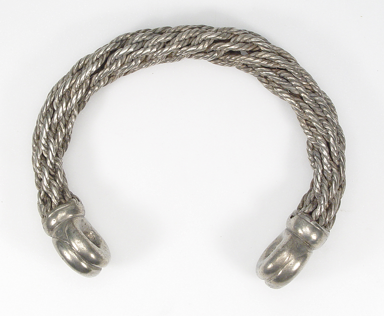 Twisted metal torc shown for comparison
