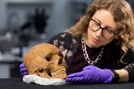 Dr Jess Thompson examines the skull of the man from Inveresk